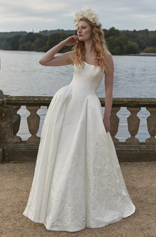 Young model wearing a white brial gown with accessories