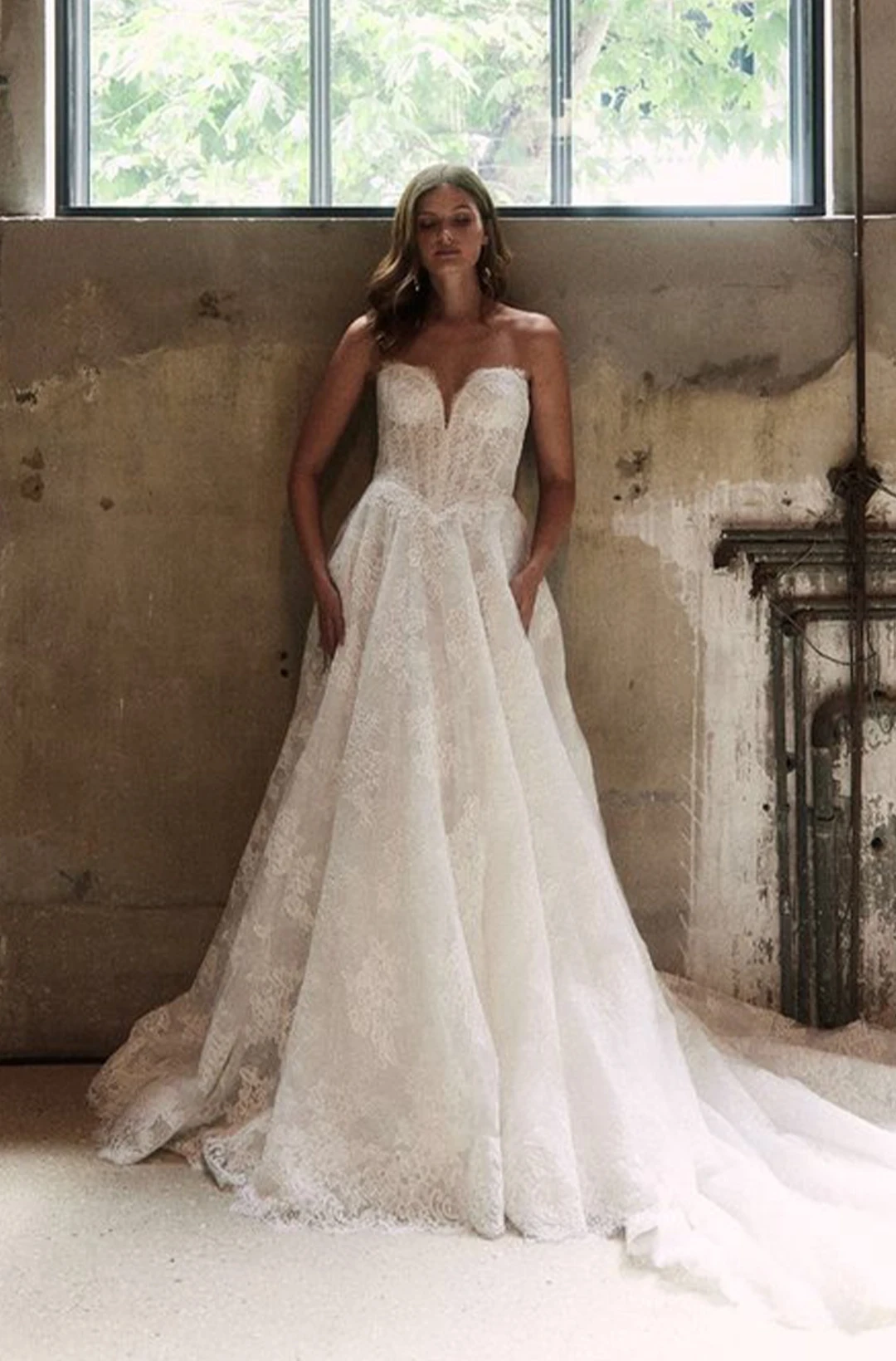 Young model wearing a white brial gown with accessories